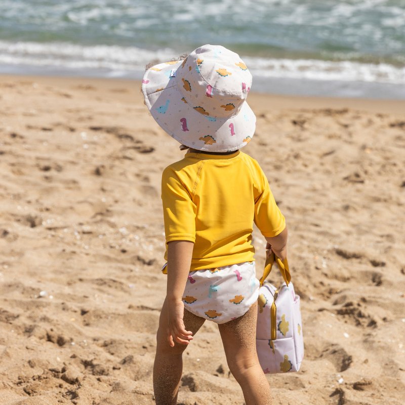 GORRO PROTECCIÓN SOLAR REVERSIBLE SARO ·DINOS· - Happy Moments Baby